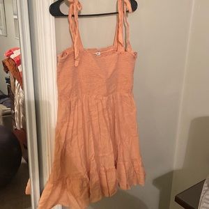 Peach colored sundress with tie straps!